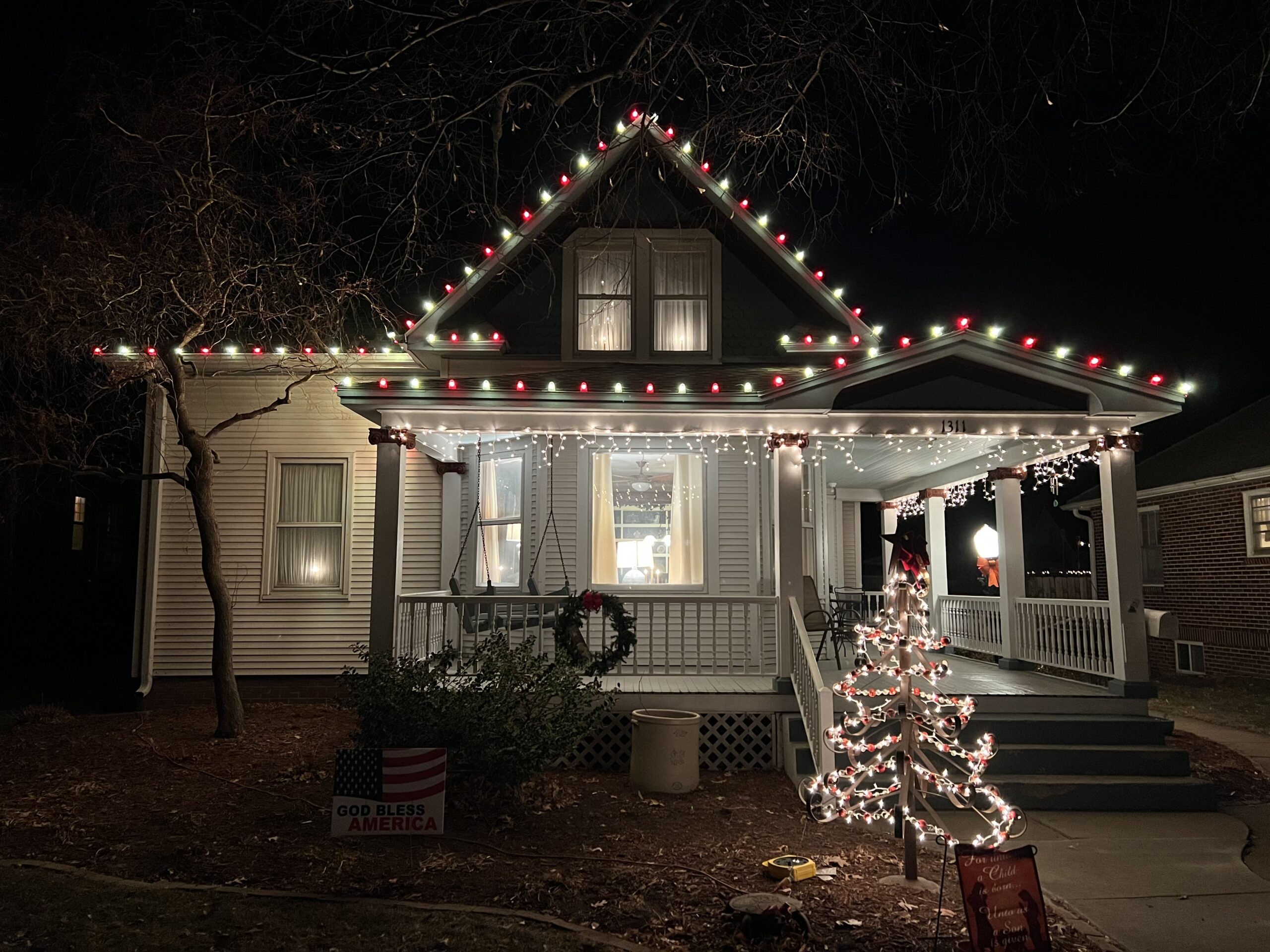 House with porch decorated with Christmas lights