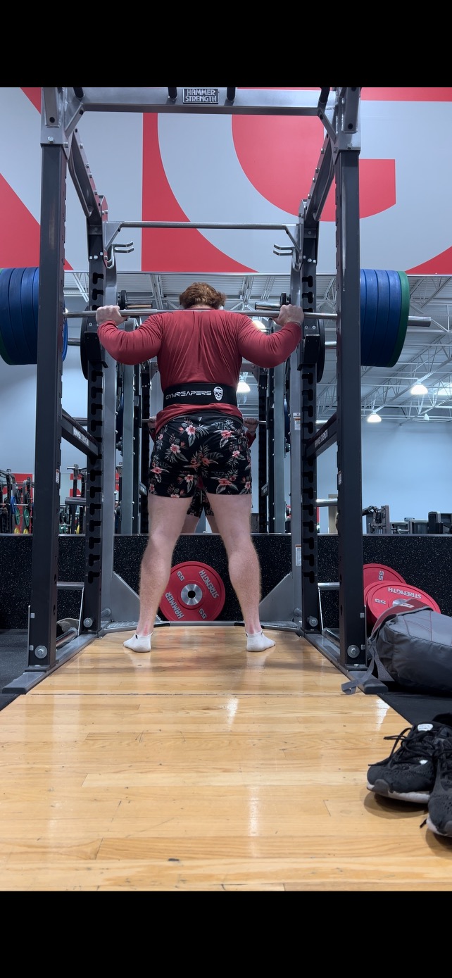 My son doing a squat in the gym